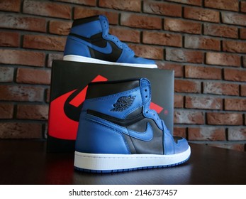 New York, United States - April 19, 2022: Nike Air Jordan 1 High, Marina Blue, Black Background