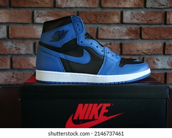 New York, United States - April 19, 2022: Nike Air Jordan 1 High, Marina Blue, Black Background