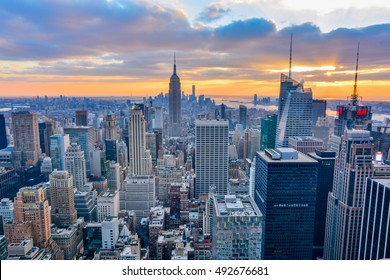 NEW YORK, UNITED STATES - DECEMBER 28, 2015 -  New York City skyline with urban skyscrapers at sunset. - Shutterstock ID 492676681