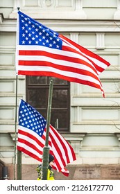 New York, United States - February 16 2022: American Flags Waiving With Part Of A Military Vehicle And Kid Or Child On It, Vertical