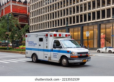 NEW YORK, UNITED STATES - Jun 14, 2022: A North Shore University Hospital, Northwell Health Ambulance Driving Down Park Avenue In Manhattan Against Modern Commercial Buildings