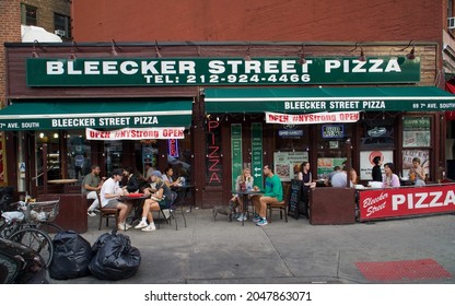 New York, New York  United States - September 25 2021: Bleecker Street Pizza Storefront In Greenwich Village On A Saturday Afternoon In Early Autumn.