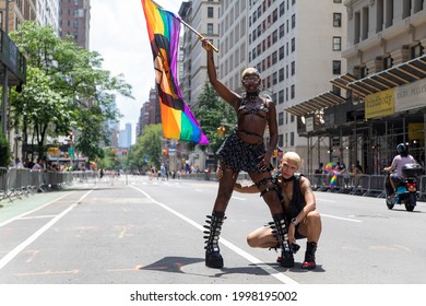 New York, New York USA - 06-27-2021 2 Young Beautiful Black Females Holding A Pride Flag At The 2021 NYC Pride Parade