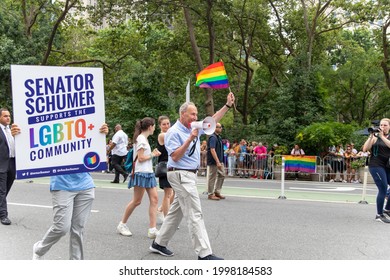 New York, New York USA - 06-27-2021 Chuck Schumer Walking Pride Parade With A Pride Flag 