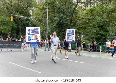 New York, New York USA - 06-27-2021 Chuck Schumer Walking Pride Parade With A Pride Flag 