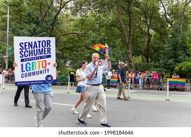 New York, New York USA - 06-27-2021 Chuck Schumer Walking Pride Parade With A Pride Flag 