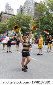 New York, New York USA - 06-27-2021 Man Holding Pom Poms  At The 2021 Nyc Pride Parade 