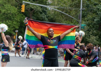 New York, New York USA - 06-27-2021 Young Gotham Cheer Man With Flag At The 2021 Nyc Pride Parade