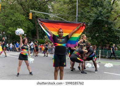 New York, New York USA - 06-27-2021 Young Gotham Cheer Man With Flag At The 2021 Nyc Pride Parade