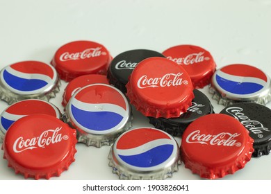New York, USA - 1 January 2021: Coke bottle caps. Coca-Cola and Pepsi drink logo, Illustrative Editorial