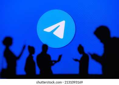 NEW YORK, USA, 1. MARCH 2022: ​​Telegram App, Group Of Business People Chat On Mobile Phone And Laptop. ​​Telegram – Freeware, Cross-platform, Cloud-based Instant Messaging. Company Logo On Screen