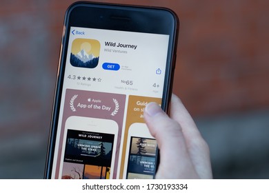 New York, USA - 1 May 2020: Wild Journey app logo close-up on phone screen, Illustrative Editorial.
