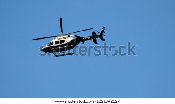 New York, New York /\
USA - 11/04/2018: New York Police Department Helicopter Flying Over\
NYC Marathon