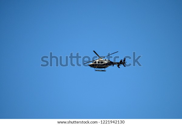 New York, New York /\
USA - 11/04/2018: New York Police Department Helicopter Flying Over\
NYC Marathon