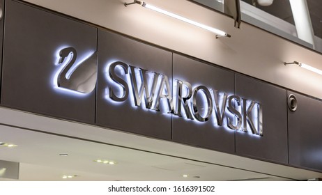 New York, New York \ USA - 21 December 2019: A logo of Swarovski brand of a side of a store in the mall of New York International Airport