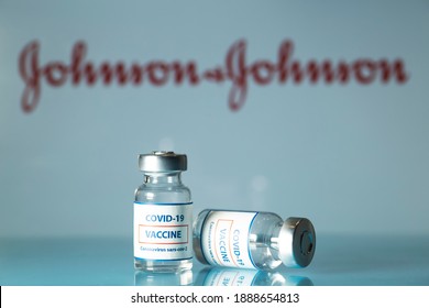 New York, USA - 22 December 2020. Concept of vaccine against COVID-19. Glass medical vials with liquid. Ampoules with coronavirus vaccine on a medical glass table. Selective focus 
