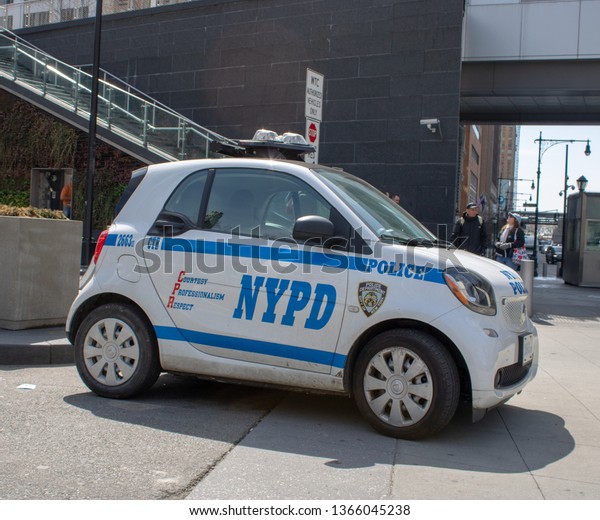 New\
York USA, 8th April 2019: A United States of America Police car\
Small Smart Car traveling on a road in New York\
City