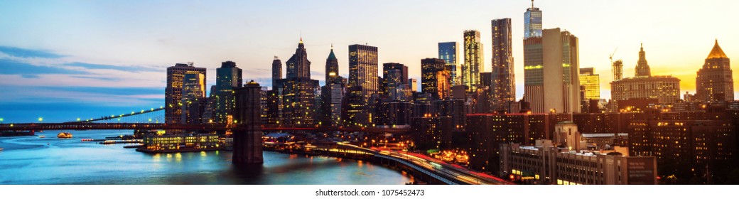 New York, USA. Aerial View On The City Skyline In New York City, USA At Night. Famous Skyscrapers Of The Concrete Jungle And Car Traffic. Brooklyn Bridge