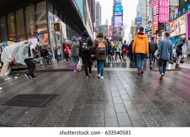 NEW YORK - USA  APRIL 22 2017 Times Square Moving People In Rainy Day New York Times Square Full Of People 