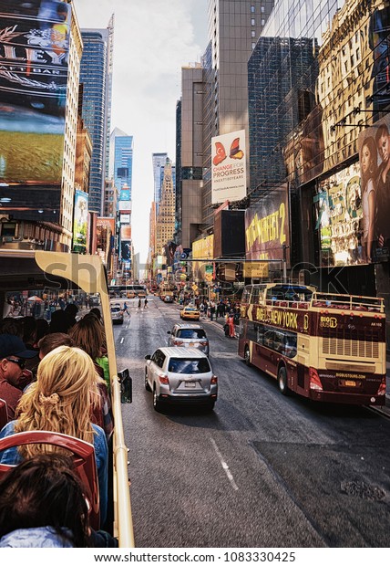New\
York, USA - April 26, 2015: Excursion bus in Times Square on\
Broadway and 7th Avenue in Midtown Manhattan in New York, USA. It\
is a commercial junction of Broadway and 7th\
Avenue