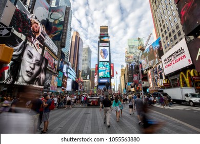 New York, USA - Aug 17, 2016: Times Square In Daytime With One Times Square (Times Tower) In The Middle Surrounded With Buildings And Billboards And People Walking On The Street