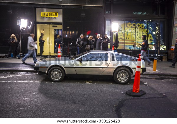 NEW\
YORK, USA - AUG 21, 2015:  people admire the famous original amc\
chrome car from the film back to the future presented at time\
square due to 25th anniversary of the Hollywood\
film.
