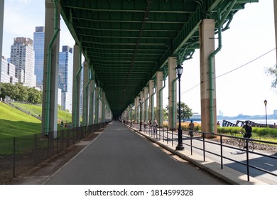 New York, New York / USA - August 1 2020: Pedestrian And Biking Trail Under The Henry Hudson Parkway Along The Hudson River In Lincoln Square Of New York City