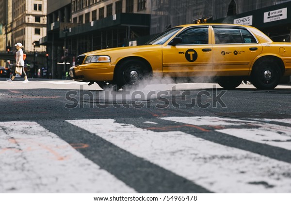 NEW YORK, USA -\
AUGUST 26, 2017: Taxi cab on the street of New York City. There is\
13,237 taxi cabs operating in New York City which have 241 million\
annual taxi passengers.