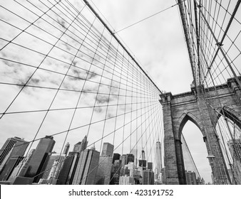 New York, USA. Black and white image of Brooklyn bridge and Manhattan from the East river. 