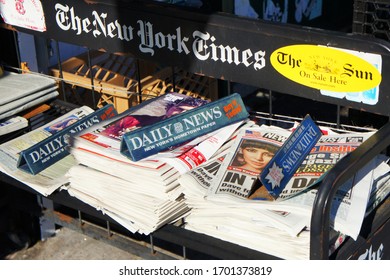 New York, USA - December 2010: Piles Of Fresh Daily Press/newspapers (Daily News, New York Times) Sold In NYC Shops In Manhattan. 