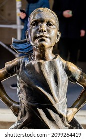 NEW YORK, NEW YORK, USA - DECEMBER 27, 2021: Fearless Girl, A Bronze Sculpture By Kristen Visbal, Outside The New York Stock Exchange.