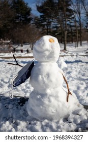 New York, New York USA - February 8 2021: Small Creative Snowman At Central Park In New York City With A Mask During The Covid 19 Pandemic