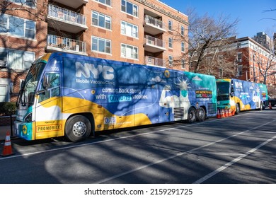 New York, New York USA - January 26 2022: New York City Mobile Covid-19 Vaccination Buses Parked Along A Street In Greenwich Village