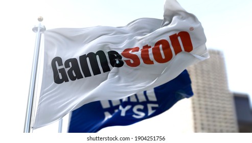 New York, USA, January 28, 2021: Flags with Gamestop and the NYSE waving in the wind. On January 28, 2021, GameStop's short squeeze raised the share price nearly 900 times in NYSE stock exchanges