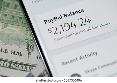 New York, USA - January 5, 2021: Using Paypal For Purchase  With Smartphone On Dollar Banknote Background