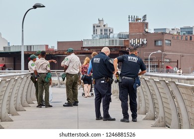 New York, USA - July 04, 2018: The NYPD And NYC Department Of Parks & Recreation Personnel Secure The Fourth Of July Fireworks In Vicinity Of The East River.