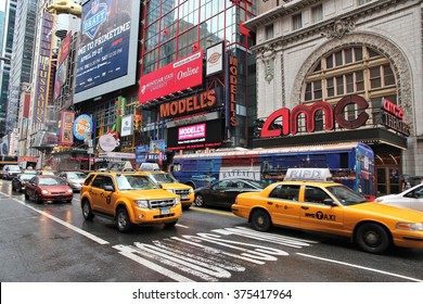 NEW YORK, USA - JULY 1, 2013: Taxis Drive By Broadway Theaters In NY. AMC Theatres Is A Multiplex Cinema.