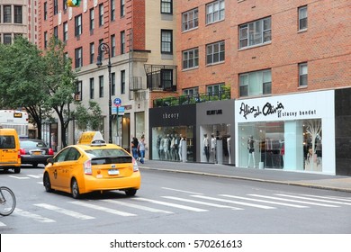 NEW YORK, USA - JULY 1, 2013: People Walk Along Madison Avenue In New York. Madison Avenue Is One Of The Most Recognized Fashion Shopping Destination In The World.