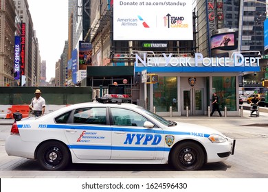 NEW YORK, USA - July 10, 2019: NYPD car on background of New York Police Department on downtown of Manhattan at summer day.