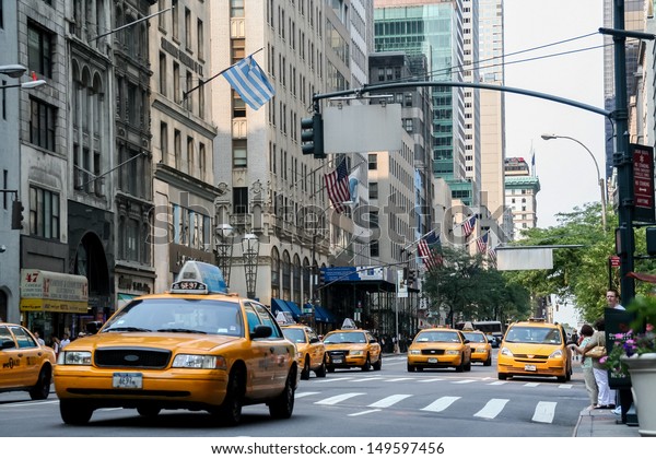NEW YORK,\
USA - JULY 13: Taxi cabs on the street of New York City at July 13,\
2008. There is 13,237 taxi cabs operating in New York City which\
have 241 million annual taxi passengers.\
