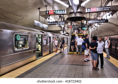 NEW YORK, USA - JULY 3, 2013: People visit a subway station in New York. With 1.67 billion annual rides, New York City Subway is the 7th busiest metro system in the world.