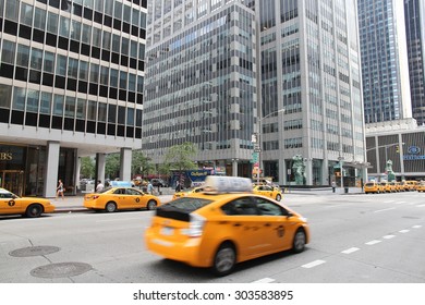 NEW YORK, USA - JULY 4, 2013: People walk along 6th Avenue in New York. Almost 19 million people live in New York City metropolitan area.