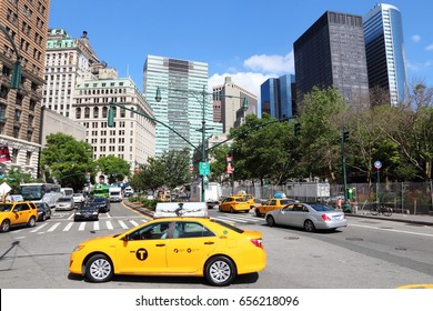 NEW YORK, USA - JULY 4, 2013: People ride yellow taxi in Lower Manhattan in New York. As of 2012 there were 13,237 yellow taxi cabs registered in New York City.