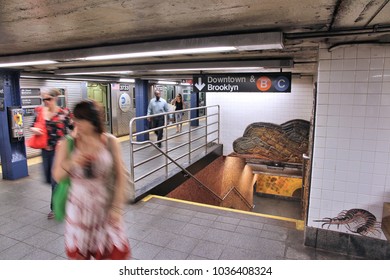 NEW YORK, USA - JULY 6, 2013: People Exit Train At Museum Of Natural History Subway Station In New York. With 1.67 Billion Annual Rides, NYC Subway Is The 7th Busiest Metro System In The World.