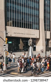 New York, USA - June 01, 2018: People By The Statue Of Adam Clayton Powell Jr. In Harlem, NYC. Since 1920s Harlem Is A Major African American Residential, Cultural And Business Center Of New York.