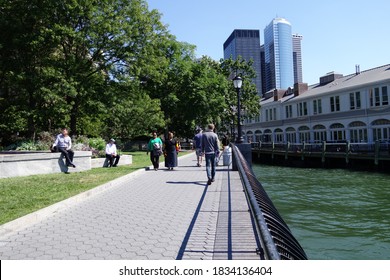 NEW YORK, USA - JUNE 18, 2019: Robert F Wagner Junior Park With People Walking Around