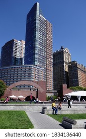 NEW YORK, USA - JUNE 18, 2019: Robert F Wagner Junior Park With People Walking Around