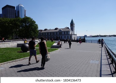 NEW YORK, USA - JUNE 18, 2019: Robert F Wagner Junior Park With People Walking Around