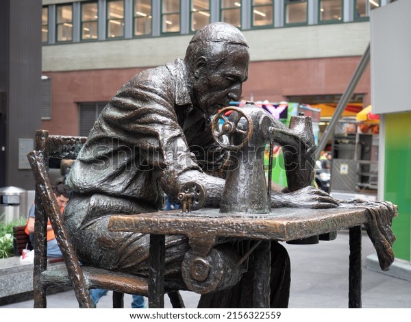 New York, USA\
- June 19, 2019: Image of The Garment Worker, a sculpture situated\
on 7th Avenue also known as Fashion Avenue in Manhattan. The\
sculpture was created by Judith\
Weller.
