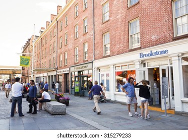 New York, New York, USA - June 2, 2011: People Stroll Along The Many  Shops On Fulton Street In The South Street Seaport In Lower Manhattan. This Once Vital Port Is Now Primarily A Tourist Area.